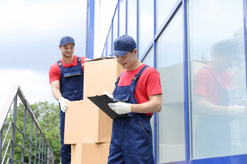 Professional movers transporting items from a flat in Croydon