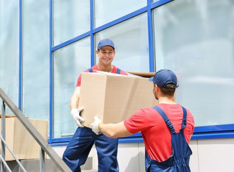 Packed boxes and furniture ready for loading on a local removal job